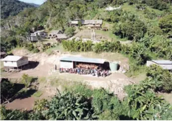  ??  ?? Preserving Kokoda … locals gather around the new museum at Alola.