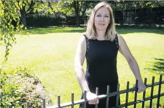  ?? PIERRE OBENDRAUF ?? Susan Kohlhoss stands in the vacant lot she and her husband wanted to sell to a buyer who intended to build on it. They were then told the lot was zoned “open public space,” leading to a battle with the city.