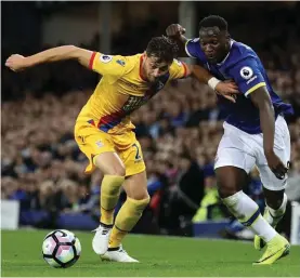  ??  ?? Crystal Palace's Joel Ward, left, and Everton's Romelu Lukaku battle for the ball yesterday Photo: AP