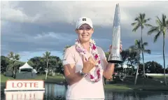 ?? AFP ?? Cristie Kerr poses with the winner’s trophy.