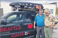  ?? ©JOSH HEALEY/THE BEACON ?? Mark Ufkes, right, from Seattle, Wash., drove 7,000 kilometres to meet Mayor Claude Elliott and thank him for Gander’s contributi­ons during 9-11.