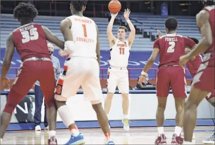  ?? Dennis Nett / Syracuse.com ?? Syracuse guard Joseph Girard III puts up a 3-pointer in the second half again Rider on Saturday. Girard made 6-of-12 attempts from long range and finished with 21 points and five assists in the Orange’s victory.