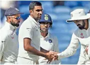  ?? — PTI ?? R. Ashwin celebrates with team mates after dismissing Australia opener Matthew Renshaw.