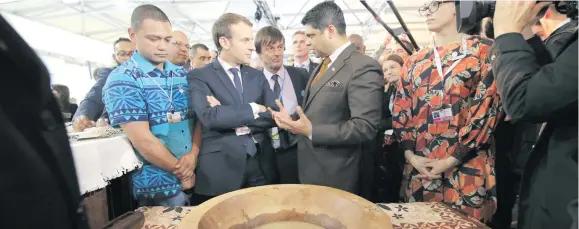  ?? Photo: Office of the Attorney-General ?? French President Emmanuel Macron (front, second from left) with Attorney-General Aiyaz Sayed-Khaiyum in Bonn, Germany.