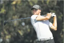  ?? Michael Macor / The Chronicle ?? Warriors guard Stephen Curry tees off during a practice round for the Ellie Mae Classic at TPC Stonebrae.