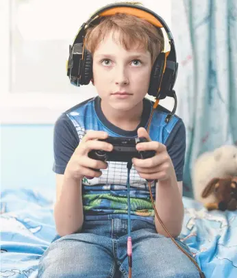  ??  ?? Green time over screen time has never been more important in the age where kids face a world of devices overload and addictive computer games such as Fortnite (left).