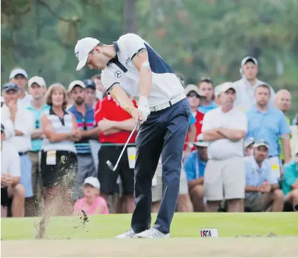  ?? MATT YORK/ THE ASSOCIATED PRESS ?? Martin Kaymer hits a tee shot during the U. S. Open in Pinehurst, N. C. on Sunday. The German trounced the fi eld by eight strokes.