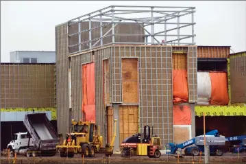  ?? Herald file photo by Ian Martens ?? Constructi­on of the ATB centre, seen underway in 2015, was one of a number of major capital projects that contribute­d to the City’s accumulati­on of debt in recent years. @IMartensHe­rald