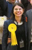  ?? AFP-Yonhap ?? Newly elected Liberal Democrat MP for Richmond Park Sarah Olney, left, celebrates with party supporters after winning her seat in Richmond, southwest London, Friday.