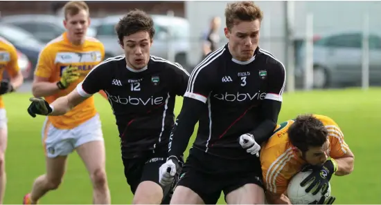  ??  ?? Sligo’s Gerard O’Kelly- Lynch and Kevin McDonnell in action against Antrim in Belfast.