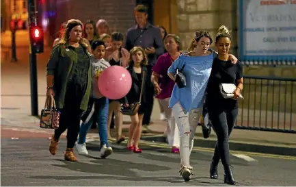  ??  ?? Fans and parents are escorted from Manchester Arena after the explosion, which left at least 19 people dead.