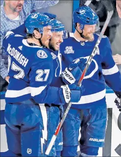  ?? Getty Images ?? GOAL POSTER: Ryan Callahan (center) celebrates his second period goal with Ryan McDonagh (r.) and Anton Stralman during the Lightning’s 3-2 win over the Capitals in Game 5 on Saturday.