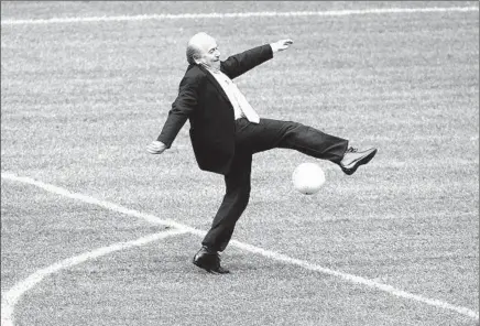  ?? Diether Endlicher
Associated Press ?? SEPP BLATTER misses the kick at a countdown event in Munich, Germany, a year ahead of the 2006 World Cup. The FIFA president, who made the surprise announceme­nt he was stepping down, said he would work on reform efforts.