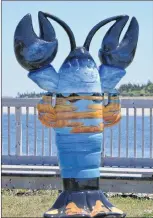  ??  ?? Cape Sable Island provides the backdrop for the lobster sculpture South Shore Dream located at Island View Park in Barrington Passage. The artist for this sculpture was Janet Moore.