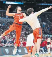  ?? RYAN SUN THE ASSOCIATED PRESS ?? Chase Hunter celebrates with Clemson teammate Daniel Nauseef after beating Arizona on Thursday.