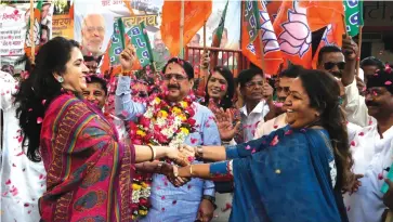  ??  ?? A file photo of BJP supporters celebratin­g the passage of the Bill for 10 per cent EWS quota in Parliament.