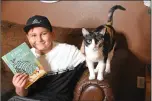  ?? STACI VANDAGRIFF/THREE RIVERS EDITION ?? Jace Ruiz, a fifth-grader at Beebe Middle School, sits on the couch with his cat, Jasmine. Ruiz started his own YouTube channel to help encourage his fellow classmates with daily activities.