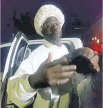  ??  ?? Buju Banton greets adoring fans on his arrival at the general aviation (private) section at Norman Manley Internatio­nal Airport in Kingston last night.