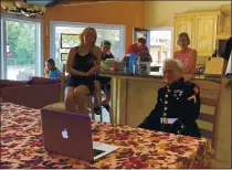  ?? TERRY CHEA — THE ASSOCIATED PRESS ?? Jerry Pedersen watches a livestream of Wednesday’s ceremony of the 75th anniversar­y of the end of WWII from West Sacramento.