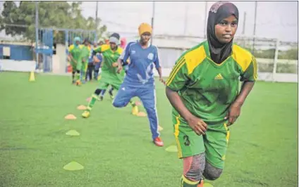  ??  ?? Defying the obstacles: Somalia’s Golden Girls in training.