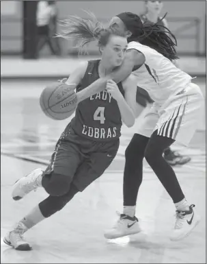  ?? The Sentinel-Record/Mara Kuhn ?? MOVING DOWN THE COURT: Malvern’s Kym Summervill­e (4) drives the ball as Fountain Lake’s Hannah Ross (20) defends during Thursday’s basketball game at Malvern.