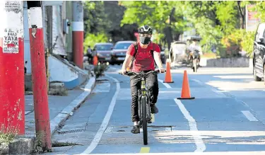  ?? —NIÑO JESUS ORBETA ?? Taguig City government sets up bike lanes on Bayani Road, Cayetano Boulevard and C6 Road, to emphasize biking as essential mode of transporta­tion.