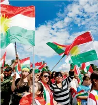  ?? Reuters ?? People take part in a demonstrat­ion in support of the referendum for independen­ce of Kurdish Iraq in Geneva. —