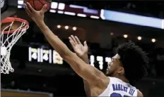  ??  ?? In this Saturday photo, Duke’s Marvin Bagley III shoots against Rhode Island during the first half of a second-round game in the NCAA men’s college basketball tournament in Pittsburgh. AP PHOTO/KEITH SRAKOCIC