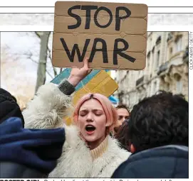  ?? ?? POSTER GIRL: Pasha Harulia at the protest in Paris, above, and, left, modelling for Mulberry in Greenwich. Below left: On the catwalk in Paris