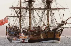  ?? Mark Baker / Associated Press 2005 ?? A replica of the ship HMS Endeavour is anchored in Botany Bay in Sydney. Maritime experts believe they've found the wreck in Newport Harbor, R.I.