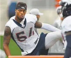  ?? Joe Amon, The Denver Post ?? Broncos linebacker Brandon Marshall injured his wrist Monday during training camp. He did not finish the practice, but coach Vance Joseph said the veteran is “OK.”