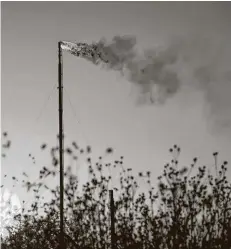  ?? Jessica Lutz / New York Times file photo ?? A Texas natural gas facility near Coyanosa flares in August 2020. President Joe Biden is reversing moves to weaken major climate-change regulation­s.