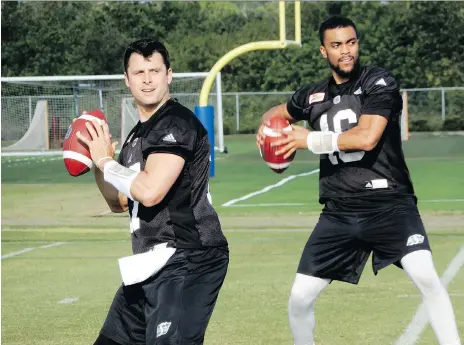  ?? MURRAY MCCORMICK ?? Saskatchew­an Roughrider­s quarterbac­ks Zach Collaros, left, and Brandon Bridge are in the most obvious battle in the CFL to win a No. 1 starter’s job heading into training camp, and on the eve of the team’s regular season opener, coach Chris Jones still...