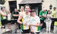  ?? Zainziapho­to.com ?? Rob James with Royton Road Runners club president June Allingan