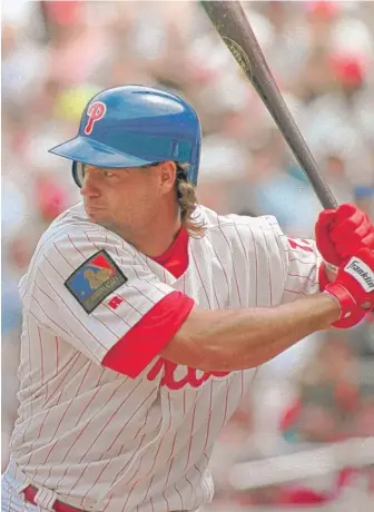  ??  ?? The Phillies’ Darren Daulton bats against the Los Angeles Dodgers in Philadelph­ia in a 1994 game. He finished his career aworld champion with the Florida Marlins in 1997.