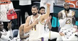  ?? Wade Payne Associated Press ?? LAKERS CENTER Marc Gasol acknowledg­es the crowd in Memphis, where he returned Sunday for his f irst game since his playing days with the Grizzlies.