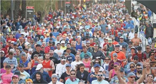  ??  ?? Runners begin the Rock ‘n’ Roll Marathon in Phoenix, Jan. 20, 2019.