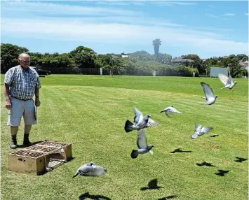  ?? Pictures: MARK CARRELS ?? FLIGHT OF FANCY: Ray Schenk releases racing pigeons at the Port Alfred Country Club open day on Saturday November 18.