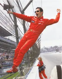  ?? Tom Strattman / Associated Press 2001 ?? Helio Castroneve­s’ nickname is “Spider-Man,” which you can understand from this Indy 500 celebratio­n in 2001.