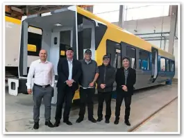  ?? STADLER. ?? Stadler staff stand with the first completed Merseyrail Class 777 bodyshell.