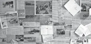  ?? MAX WHITTAKER/NEW YORK TIMES ?? Newspaper clippings about successful rescues, along with thank-you notes, hang last month on a bulletin board at Tip Top Search and Rescue in Pinedale, Wyo.