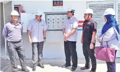  ??  ?? Nasser (third right) with SESB engineers and management team visiting the SESB sub-station at Bangunan JBA Jumidar Buyong, yesterday.