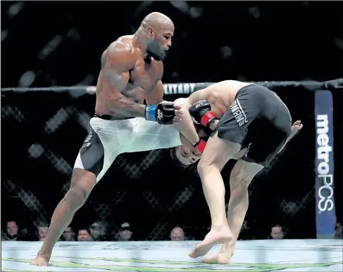  ?? GETTY IMAGES ?? Yoel Romero, seen here landing a knee on Chris Weidman in 2016, will fight Luke Rockhold for the interim middleweig­ht title.
