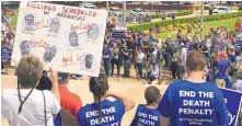  ?? KELLY P. KISSEL/ASSOCIATED PRESS ?? Protesters gather outside the state Capitol building on Friday in Little Rock, Ark., to voice their opposition to Arkansas’ seven scheduled executions.