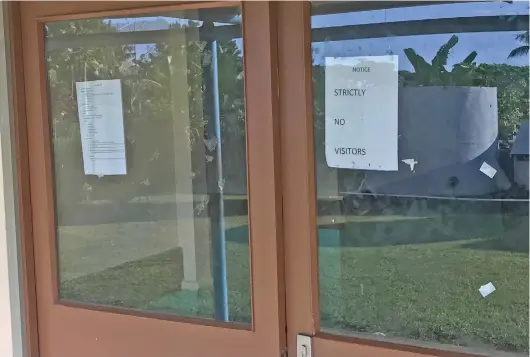  ?? Photo: Waisea Nasokia ?? Notice pasted on the door of the paying ward at the Nadi Hospital yesterday where two Fijians are kept in isolation.