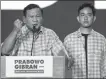  ?? WILLY KURNIAWAN / REUTERS ?? Indonesia’s Defense Minister and leading presidenti­al candidate Prabowo Subianto (left) delivers a speech with his running mate Gibran Rakabuming Raka in Jakarta on Wednesday.