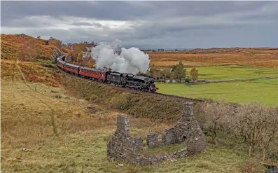  ?? ?? The last week of West Coast Railways’ ‘Jacobite’ runs for 2022 saw the use of Keighley & Worth Valley Railway-based LMS ‘Black Five’ No. 45212, seen just after Arisaig heading for Mallaig on October 25. See also pages 64-67. DAVE COLLIER