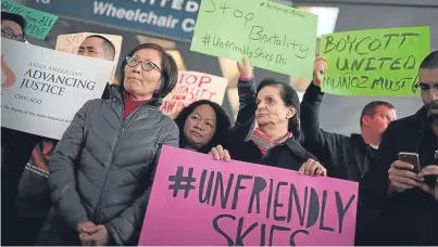  ?? Picture: Getty. ?? Protests following the enforced ‘deplane’ of Dr Dao by United Airlines.