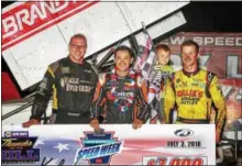  ??  ?? COURTESY THUNDER ON THE HILL RACING SERIES
Race winner Kyle Larson, center, poses with Greg Hodnett, left, and Kasey Kahne, right, after the 410 sprint race at Grandview Speedway during Pa. Speedweek on July 3.