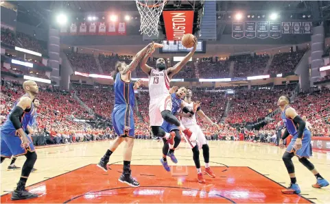  ?? AP ?? The Rockets’ James Harden goes up for a shot as the Thunder’s Steven Adams defends during the second half.
